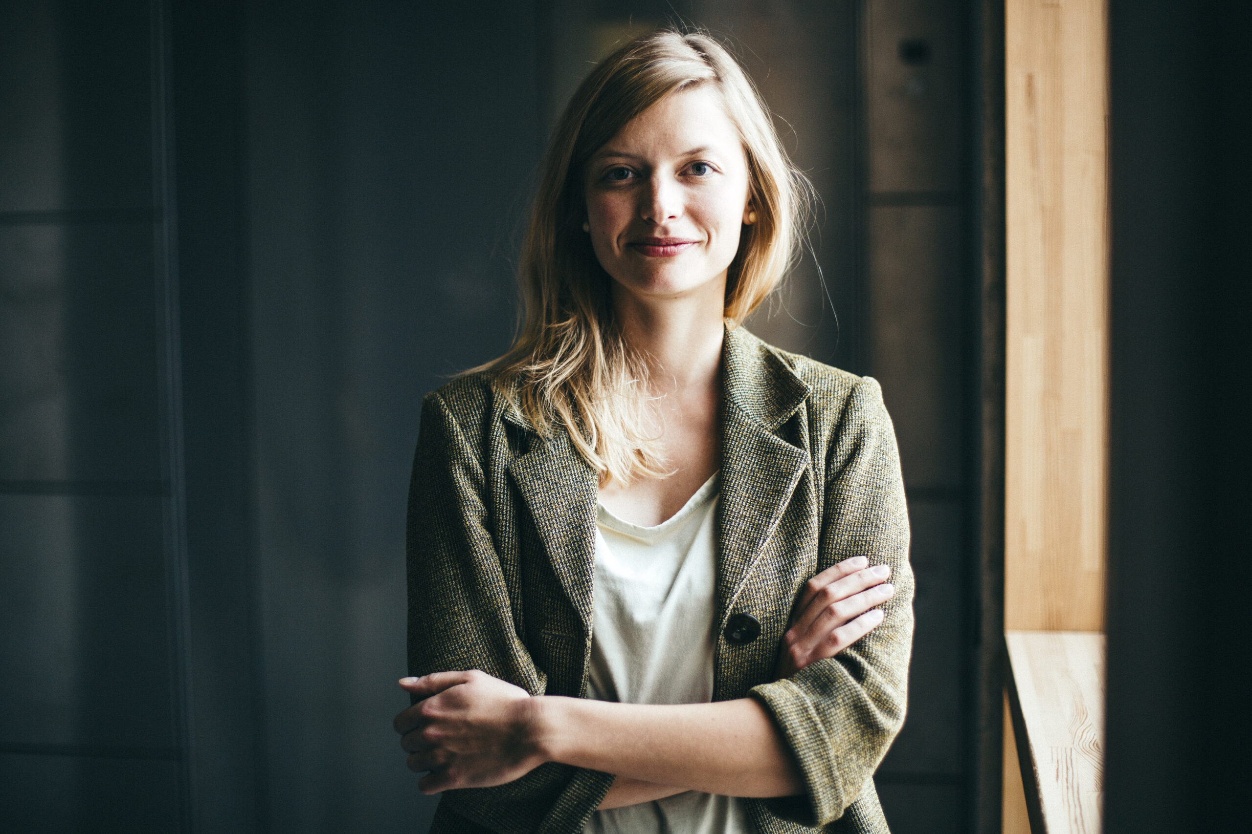 portrait mid adult woman smiling by window
